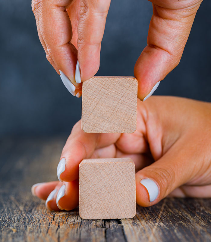 Business concept on dark and wooden background side view. hands